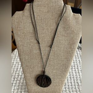 Adjustable Bohemian style, rope medallion necklace.